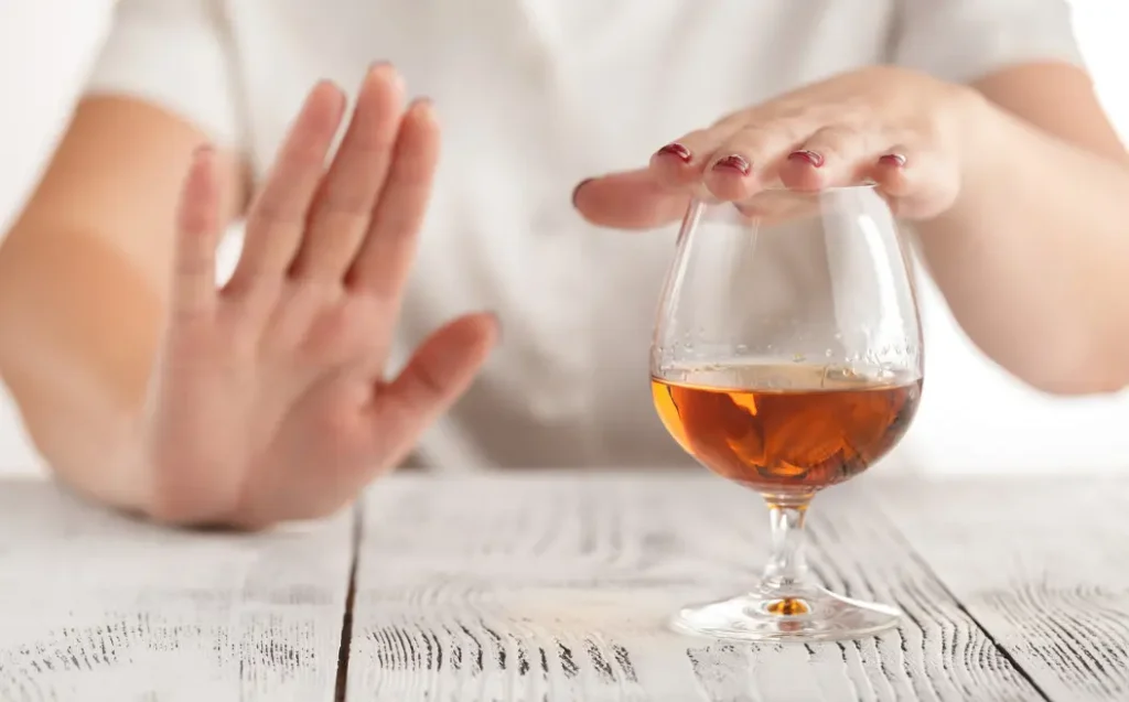 woman refuses to drink a alcohol