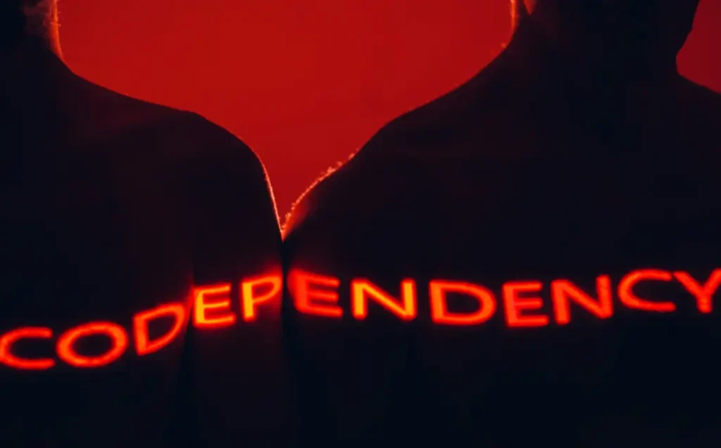 Two Adult Standing Together with Codependency Word On Body