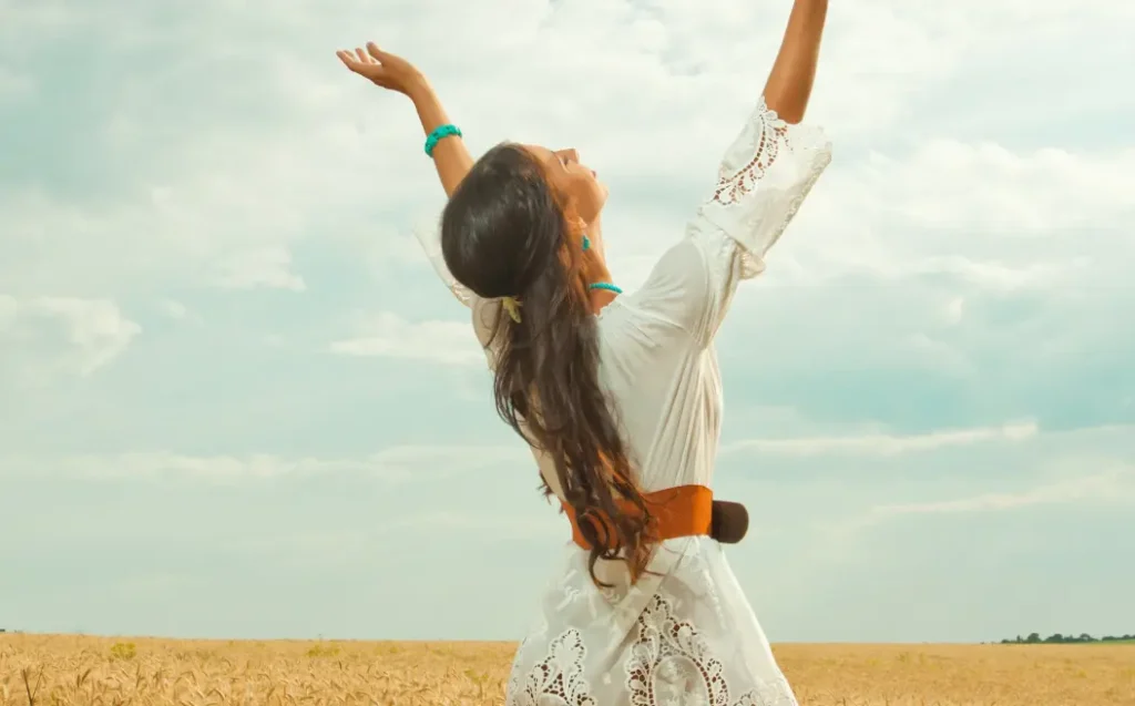 woman in wheat field enjoying nature