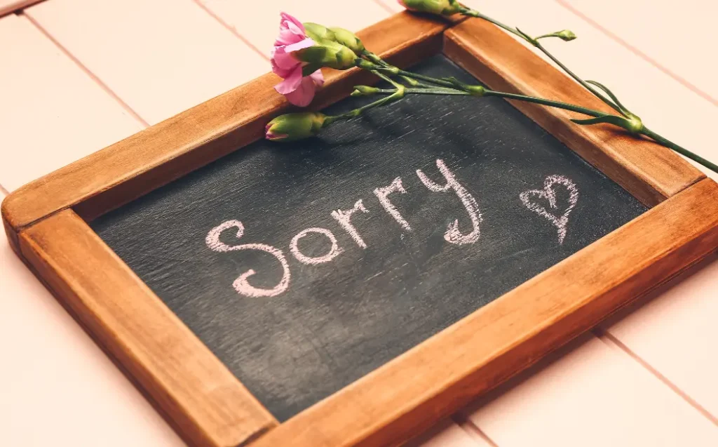 Chalkboard with Word SORRY on Table